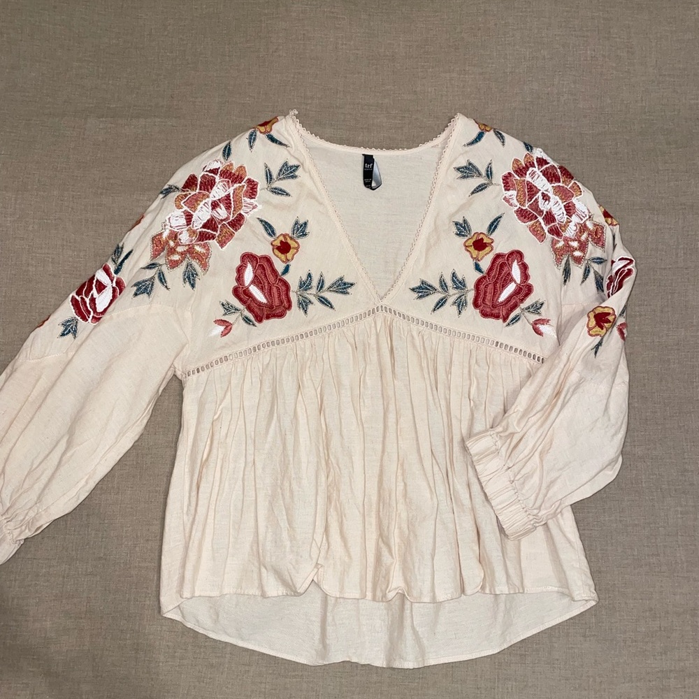 Blush pink blouse with pretty flower stitching